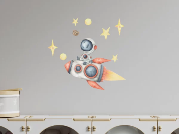 Väggklistermärken barn, en raket med en astronaut som sitter på den